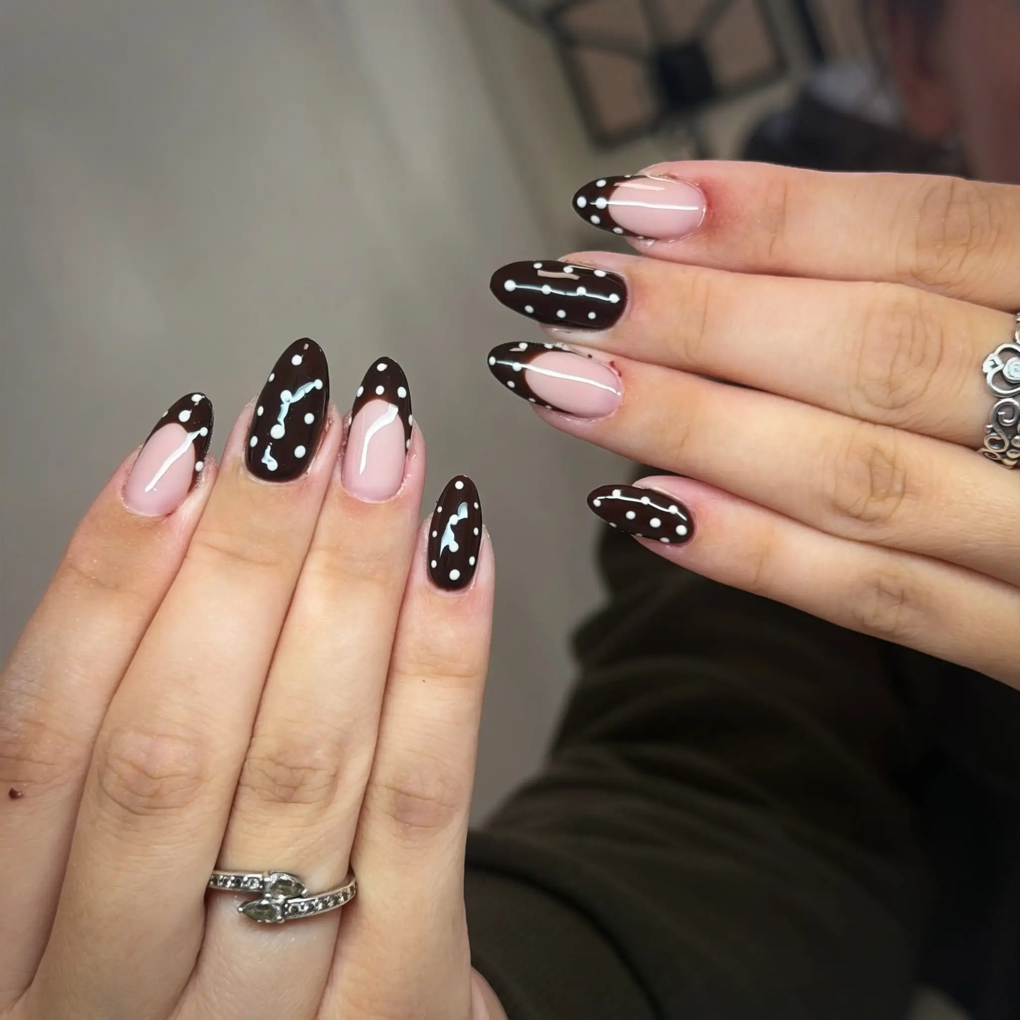 Chocolate French tips with white polka dots