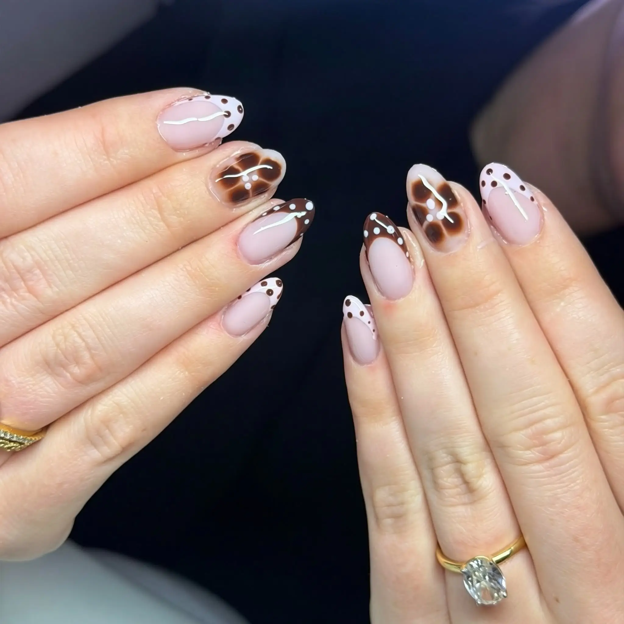 Tortoiseshell and polka dot French tip nails
